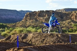 YZ450F Team Yamaha Blue with rider overlooking track}